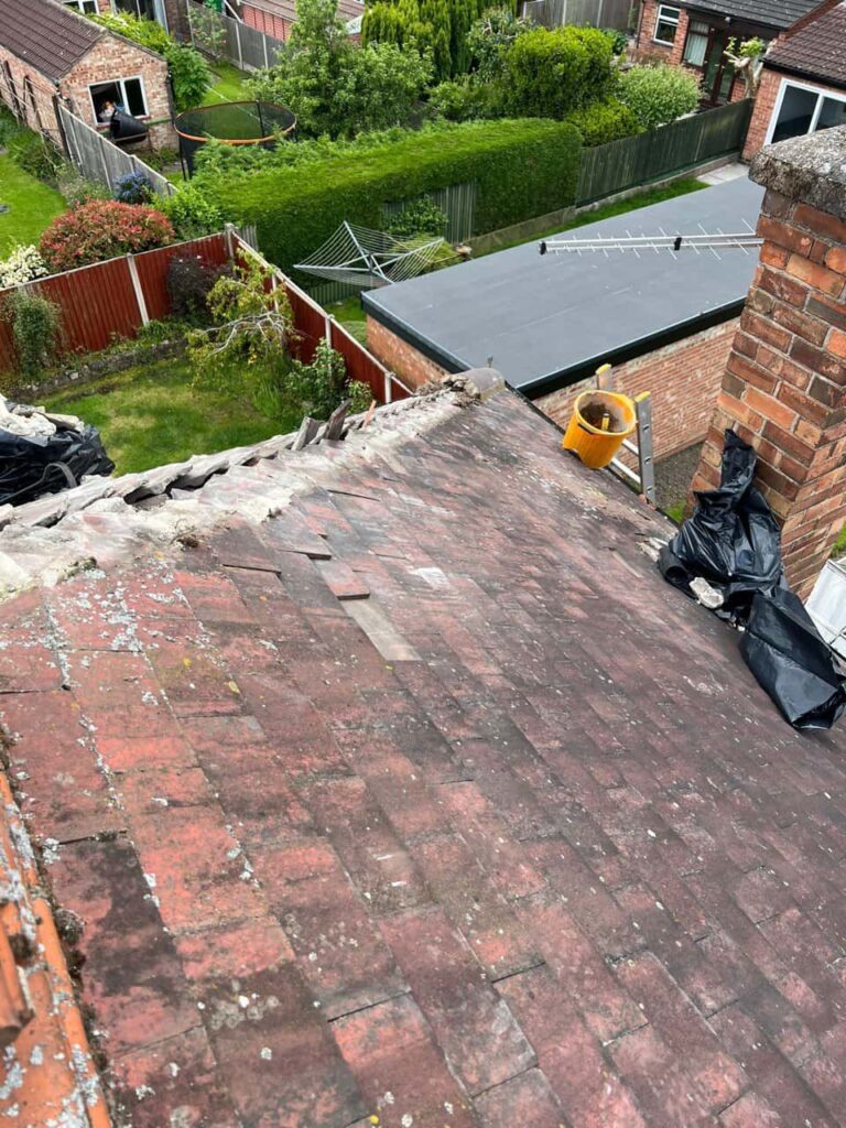 This is a photo of a roof where the hip tiles have been removed, and are just about to be replaced. Works carried out by Eastwood  Roofing Repairs