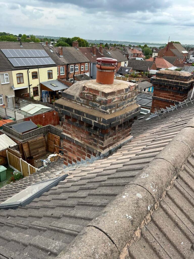 This is a photo taken from a roof which is being repaired by Eastwood Roofing Repairs, it shows a street of houses, and their roofs
